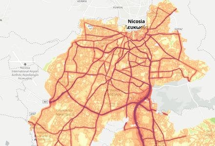 The Cyprus Noise map of Nicosia, its built-up area shaded by road traffic noise with the motorways darkest, and then the card the map prints for one spot in it: 60-64 dB all day and 50-54 dB at night, both above the World Health Organization limit, with industry at 40-44 dB by day and below 40 at night, and no aircraft data.